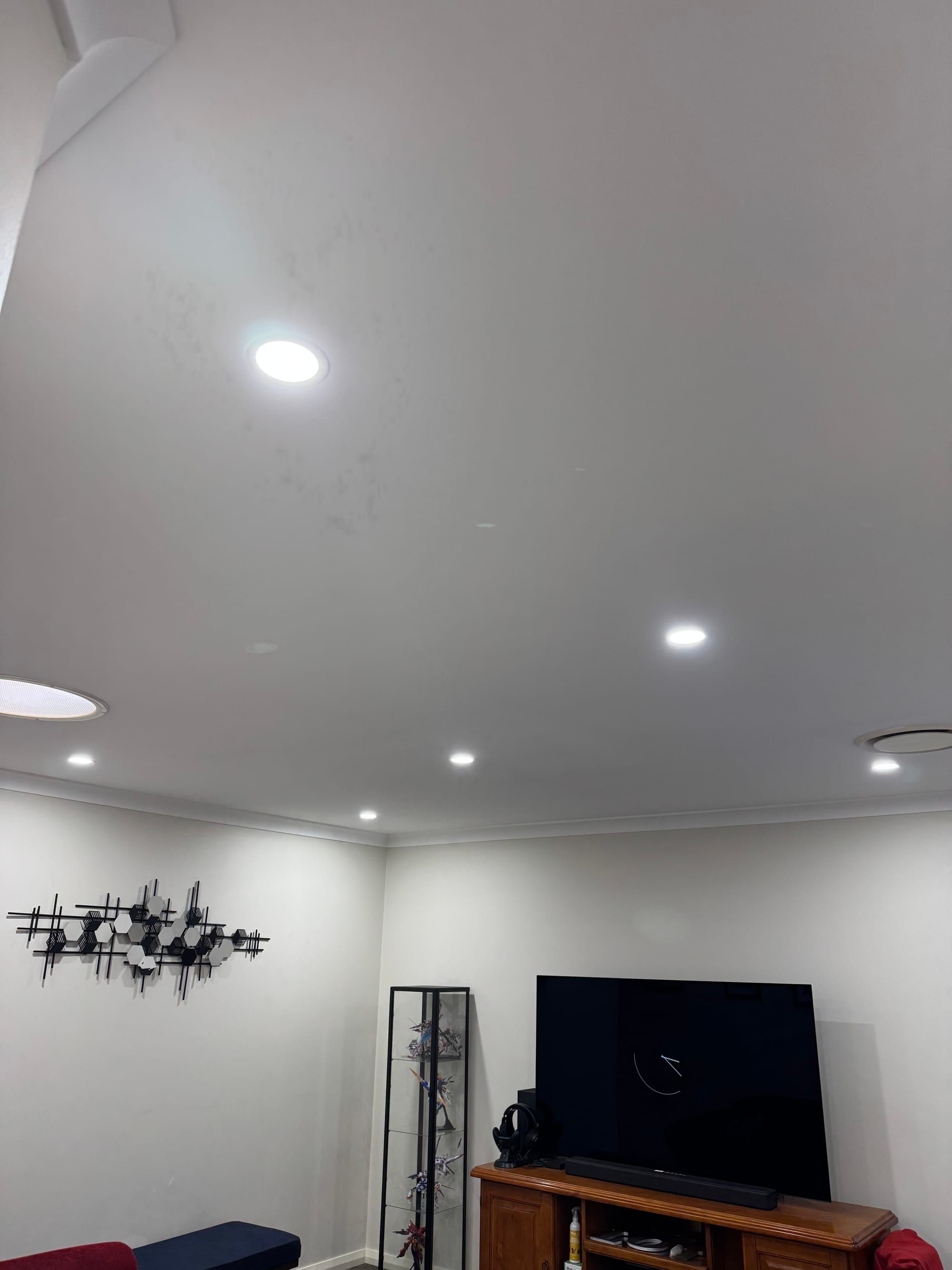 LED downlights installed throughout a living room ceiling