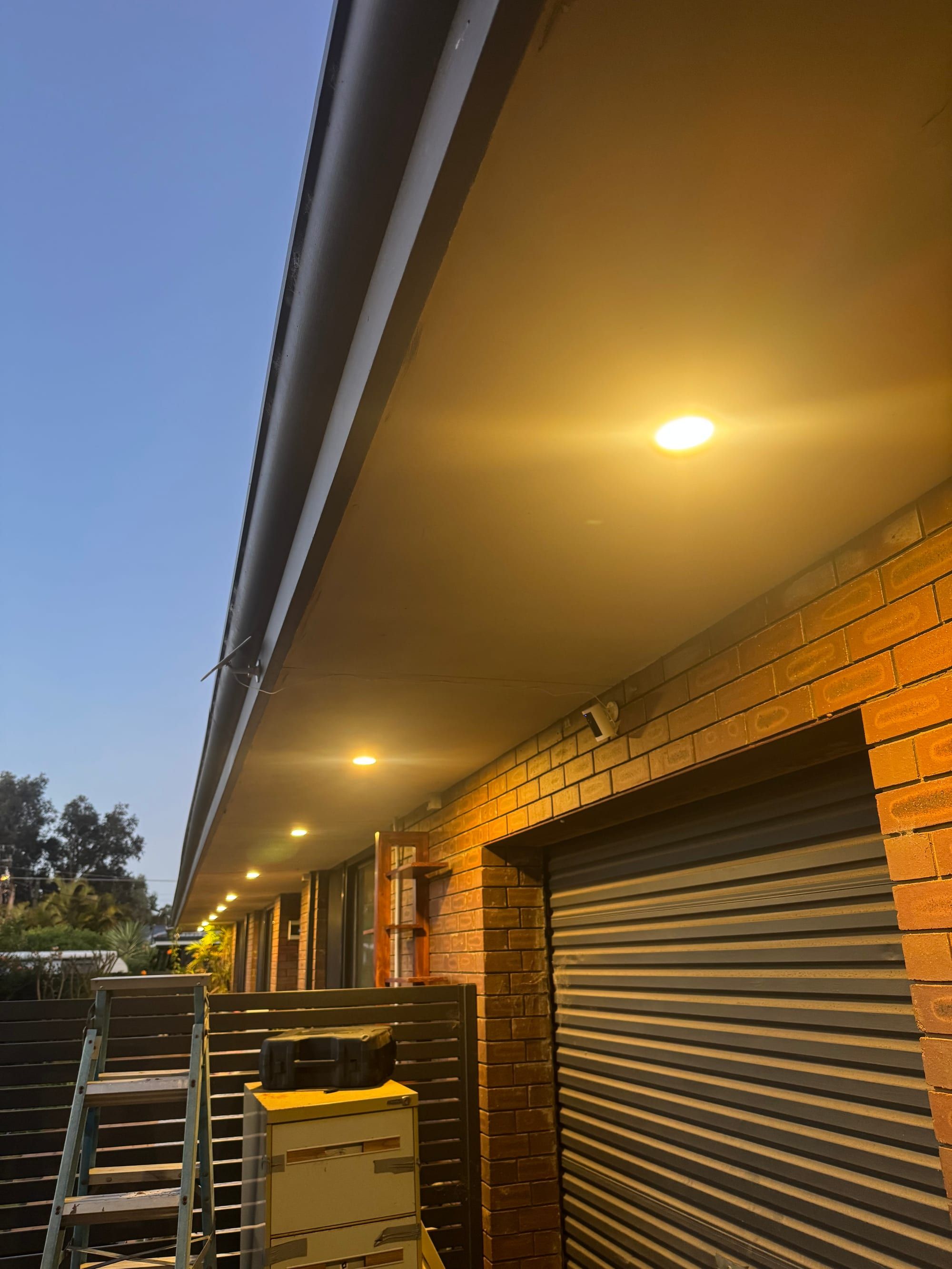 Alfresco eave lighting installed along an outdoor entertaining area